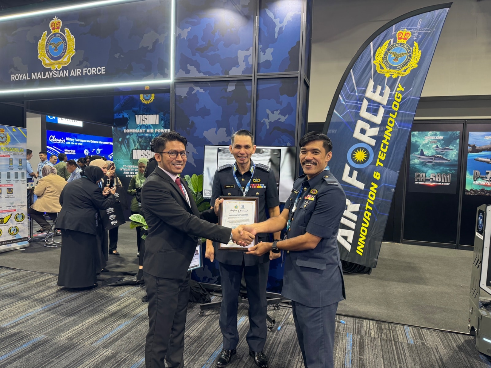 Benua Defence receiving certificate of achievement from Royal Malaysian Air Force
